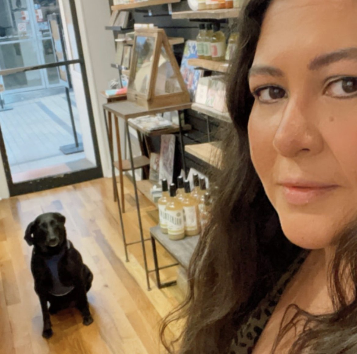 Owner Marrah Florita and her dog Lu in her shop in the historic Arcade in downtown Nashville