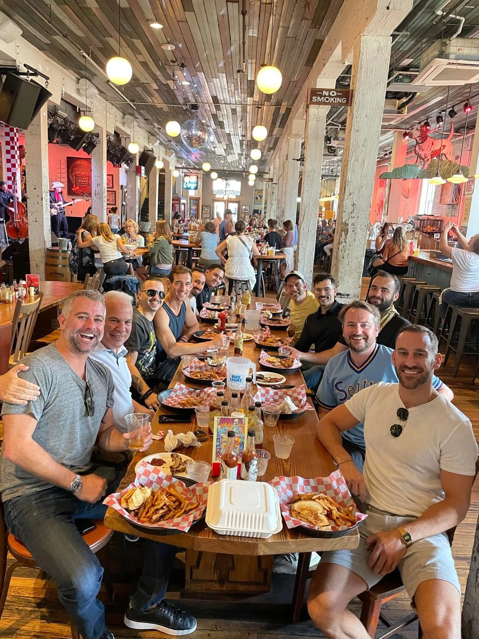 A Little Local Flavor food tour group of guys eating at Acme Feed and Seed in downtown Nashville