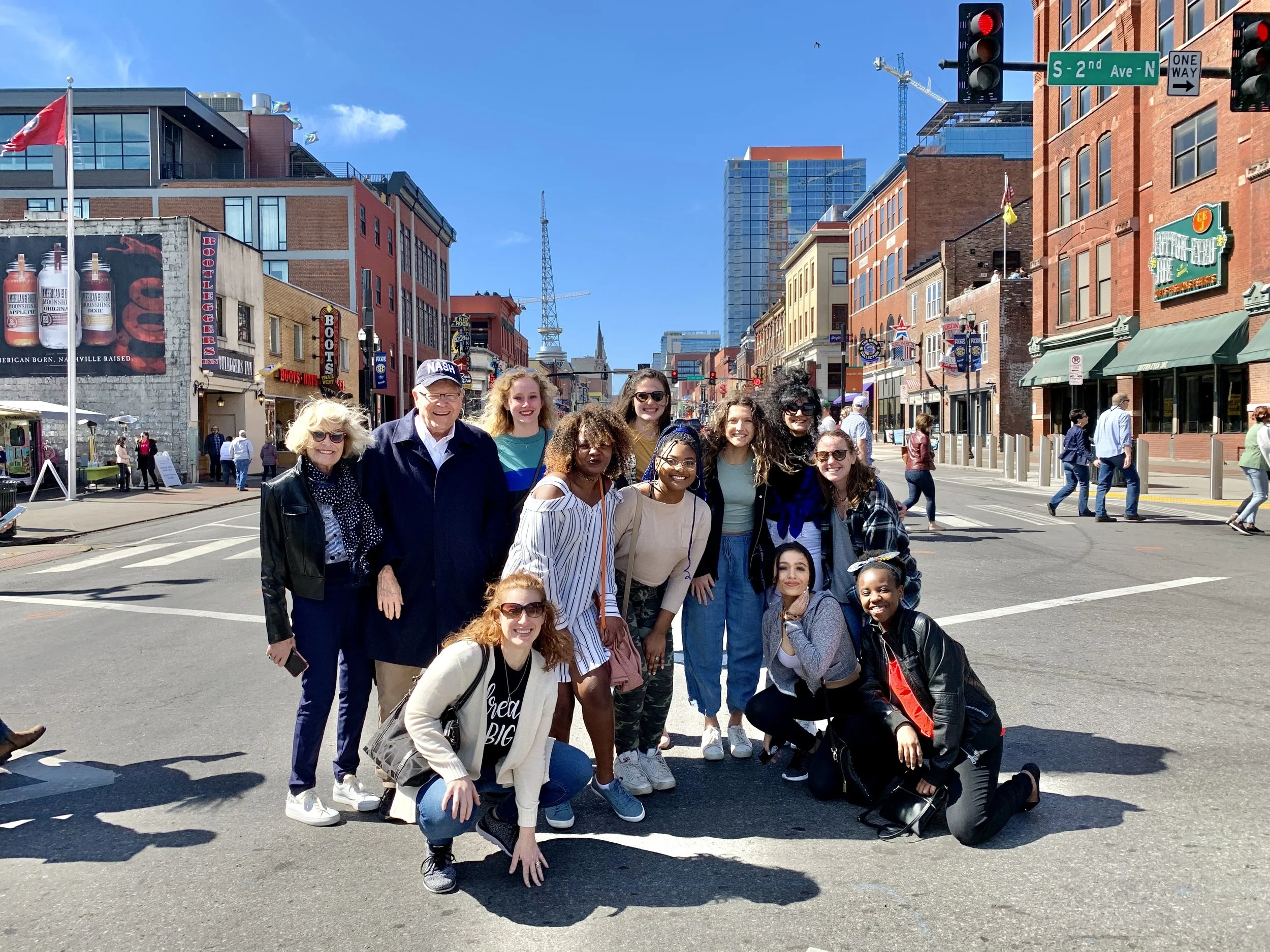 A Little Local Flavor food tour group walking on Broadway in downtown Nashville